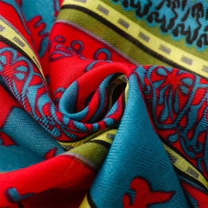 Macro detail of ethnic totem printed fabric with bohemian patterns and vibrant colors