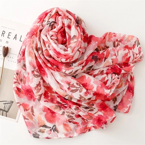Lightweight cotton linen scarf with vibrant floral print and elegant fringe details