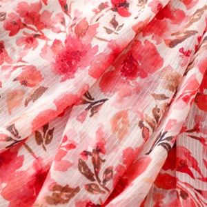 Detail of red floral print on lightweight cotton-linen scarf with fine vertical texture