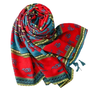 Ethnic bohemian shawl scarf with red totem print and tassels on white background