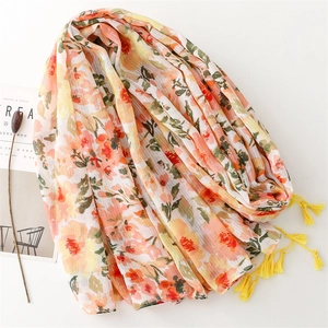 Detailed texture of cotton-linen feel floral scarf with vibrant yellow tassel fringe