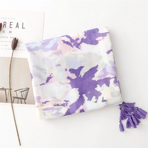 Detail of soft ink painting scarf with purple tassels and abstract floral pattern print