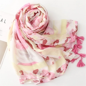 Close-up of lightweight floral long shawl with soft tassel fringe and ink painting print