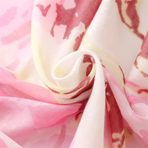 Macro shot of abstract ink painting pattern on soft lightweight cotton scarf fabric
