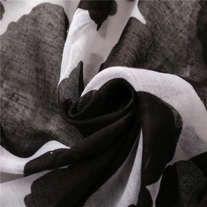 Lightweight black floral cotton linen feel scarf with black and white marble pattern texture