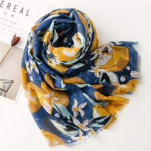 Blue cotton linen scarf with yellow lemon print and floral patterns featuring frayed edges