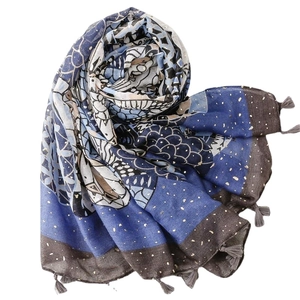 Ethnic printed scarf with gold foil accents, blue geometric patterns and soft tassels