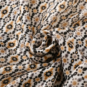 Detail of soft cotton-linen scarf featuring vintage geometric floral print and textures