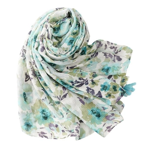 Floral cotton-linen scarf with blue fringe and elegant botanical print patterns