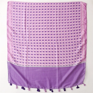Detail of purple floral cotton linen feel scarf with geometric patterns and tassel trim