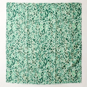 Detail of light green cotton linen feel scarf with gold foil leopard print and soft edges