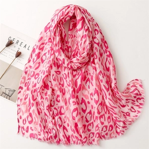 Pink leopard print scarf with fringe edges and soft linen feel for elegant women