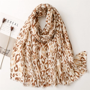 Elegant leopard print scarf with soft fringe edges in classic brown tones on white