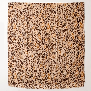 Detail of leopard print scarf featuring soft cotton-linen texture and frayed edges