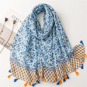 Floral cotton linen feel scarf with blue flower patterns and colorful tassels