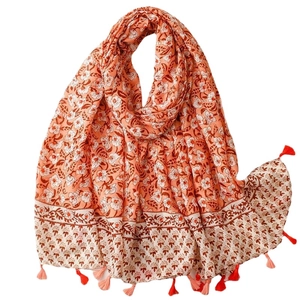 Floral cotton linen scarf in coral orange with white flower print and soft fringe tassels