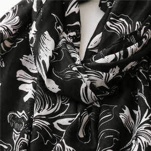 Detail of herringbone weave texture on a vintage black and white floral cotton scarf