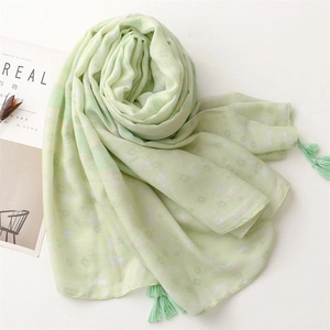 Green cotton linen floral scarf with elegant small flowers and fringe tassels for women
