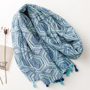 Ethnic blue geometric print cotton linen scarf with tassels on white background