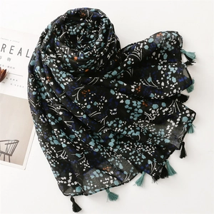 Navy floral print cotton linen feel scarf with tassels for sun protection and travel