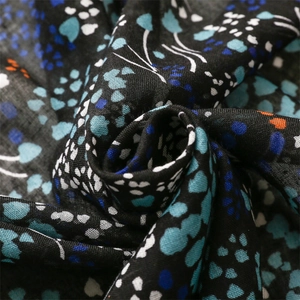 Detailed macro shot of vintage floral pattern on breathable linen cotton scarf fabric