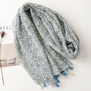 Elegant light blue floral cotton linen scarf with tassels for spring and summer