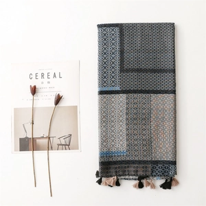 Geometric printed cotton-linen scarf with elegant tassels and Nordic lifestyle aesthetic