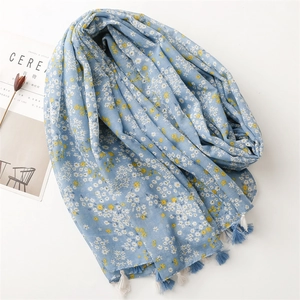 Light blue floral scarf with elegant long tassels made of soft cotton linen fabric