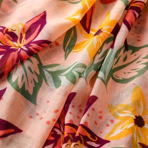 Close-up of tropical floral pattern on cotton-linen feel beach shawl scarf