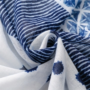 Detail of blue and white geometric print on cotton linen textured summer scarf