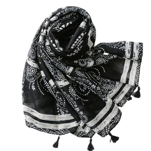 Black and white paisley print scarf with fringe tassels for sun protection and beach wear