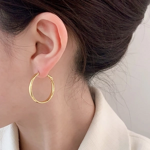 Classic gold polished hoop earrings for women featuring a minimalist mirrored finish
