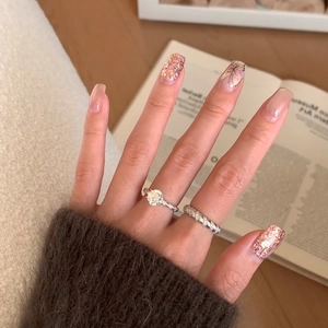 Detail view of a six-prong sparkling zircon ring set with twisted pave bands on hand