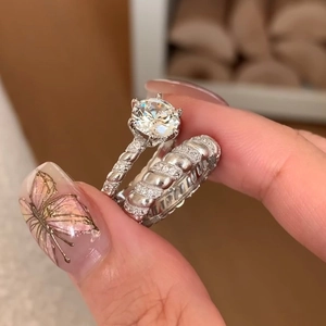 Luxury sparkling cubic zirconia ring set with twisted pave bands and round-cut center stone