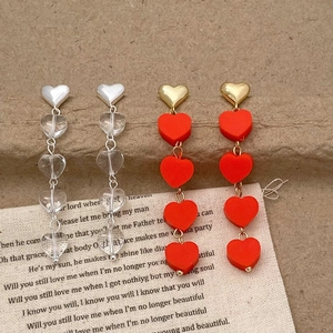 Romantic heart tassel drop earrings in silver and red gold long beaded dangle design
