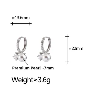 Detailed view of silver pearl earrings with dimensions 13.6mm width and 22mm height