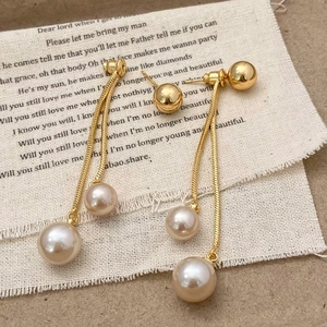 Elegant champagne gold fringe earrings with double chain pearl drops for a chic style