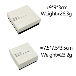 Detailed view of two minimalist white and black jewelry boxes with size and weight specs