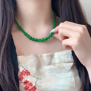 Elegant green chalcedony beaded necklace shown on model in a retro style