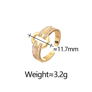 Macro detail of gold plated double layer ring with zircon inlay and linear texture
