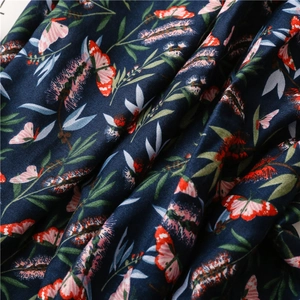 Detail of navy cotton linen scarf with vintage butterfly and floral pattern print