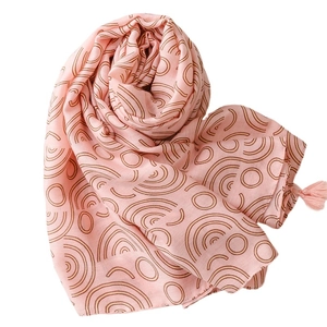Pink cotton-linen scarf with brown geometric circle patterns and fringe decorative tassels