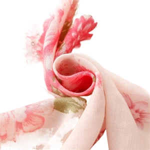 Elegant pale pink linen scarf with delicate floral prints and soft lightweight texture