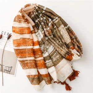 Bohemian orange and brown striped scarf with elegant tassels and artistic texture