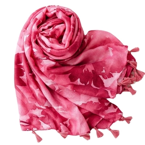 Pink bohemian ink print summer scarf with tassels arranged in a heart shape