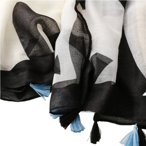 Linen feel cotton scarf with black and white geometric print and tassel fringe details