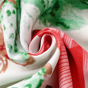 Macro detail of twill fabric lotus print silk scarf with fine texture and fringe