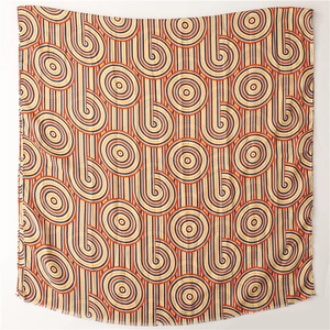 Detail of colorful geometric spiral pattern on a soft lightweight shawl with frayed edges