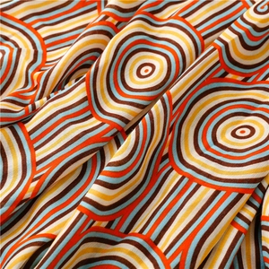 Detail of soft rainbow circle pattern on cotton-linen feel scarf with elegant texture