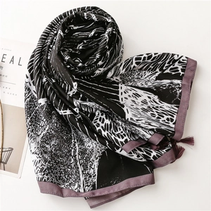 Detail of artistic black and white pattern with soft lavender fringes on lightweight shawl